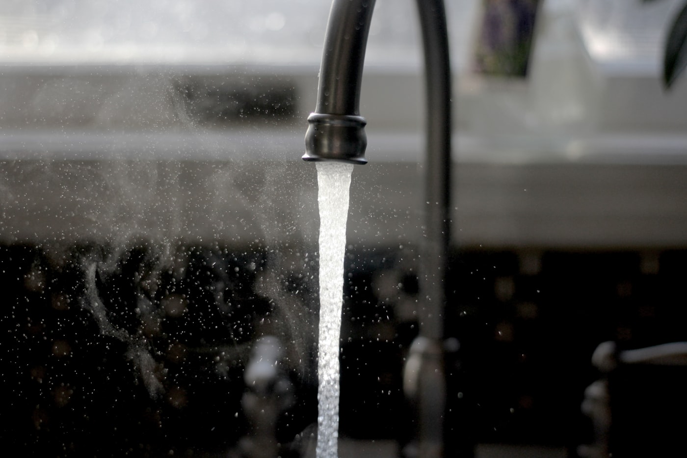 Water running strong from a kitchen faucet