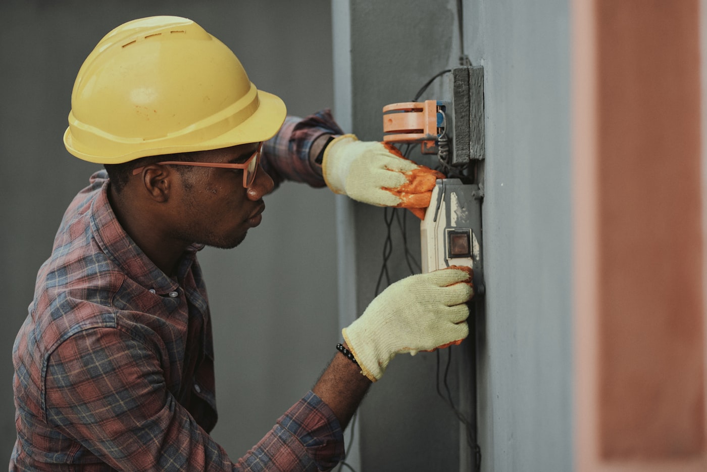 Technician in a hard hat working on-site